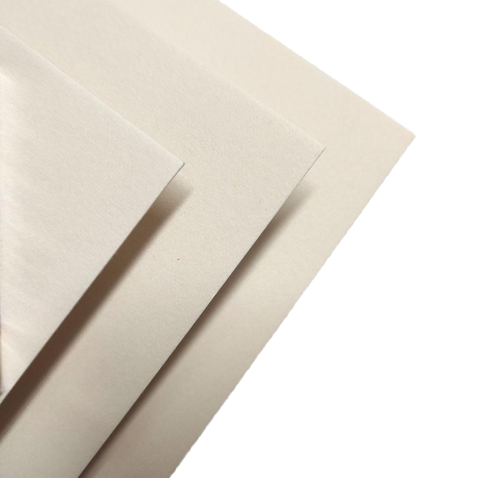 Layered sheets of premium cream specialty paper stock, luxury print material by Embossed Studio